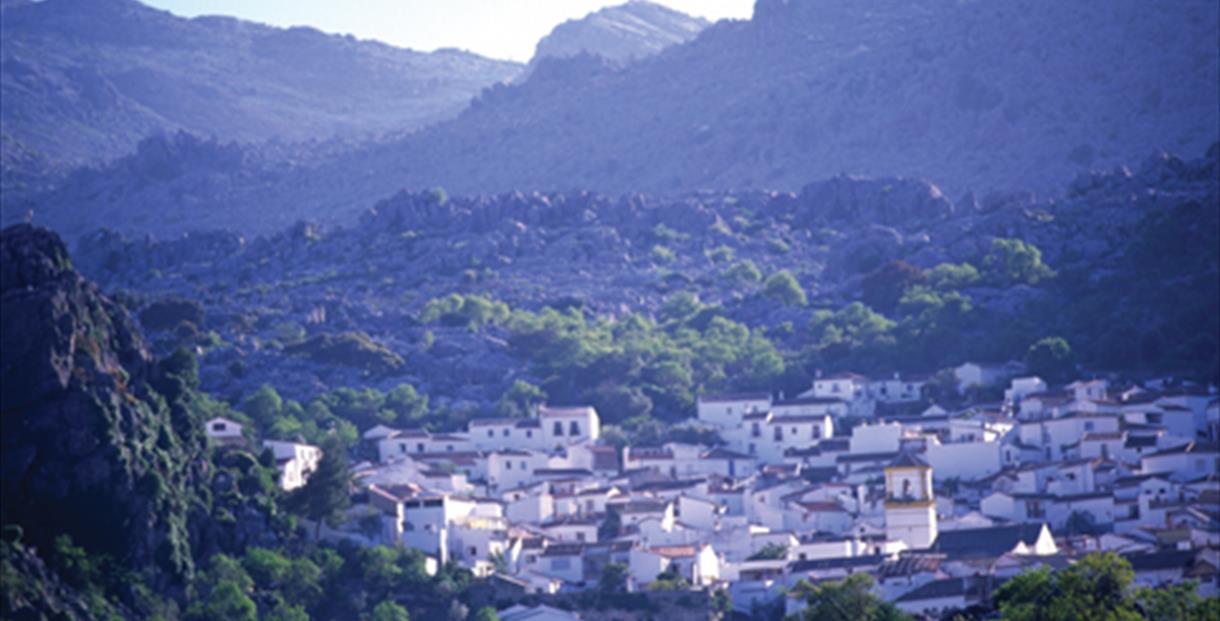 Panoramic view of Montejaque white village beneath the limestone peaks of the Sierra de Grazalema